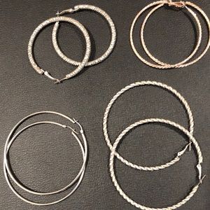 Earring Suite  4 pairs range from 3 to 2 inches in diameter in good condition.l